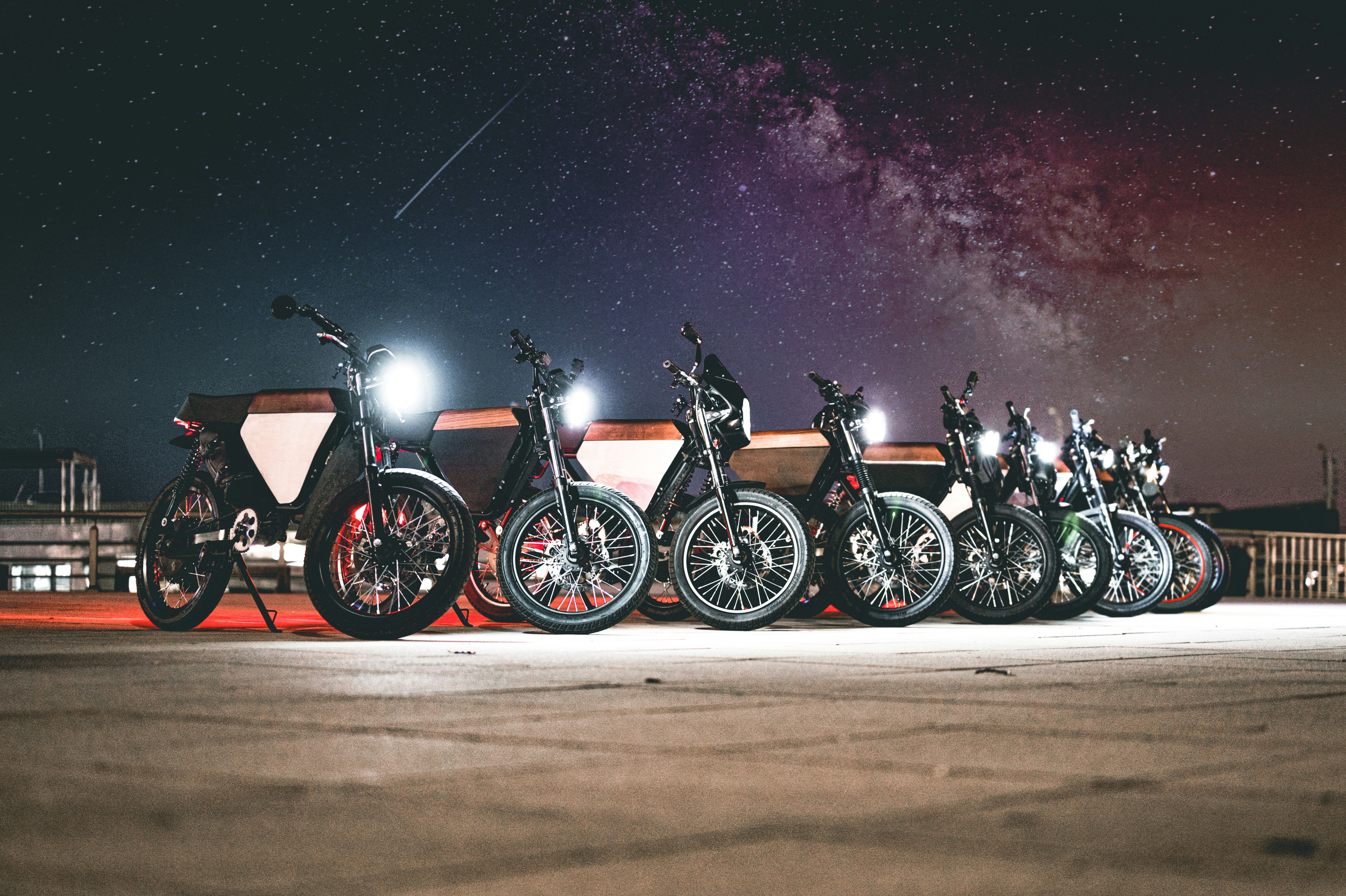 black and red motorcycle on road during night time